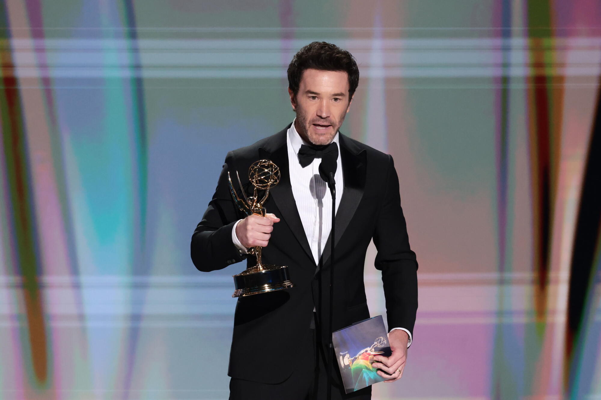 Tom Pelphrey accepts his Emmy for supporting actor in a drama series for "Task" during the 78th Emmy Awards.