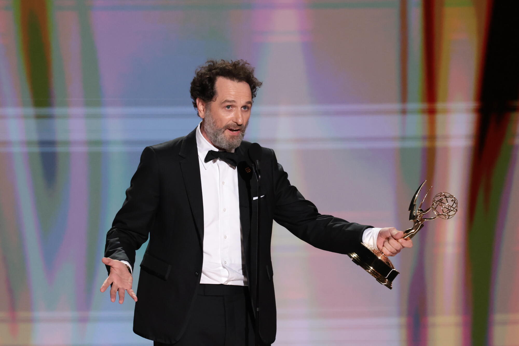 Matthew Rhys accepts the Emmy for lead actor in a comedy series for "Widow's Bay" during the 78th Emmy Awards.