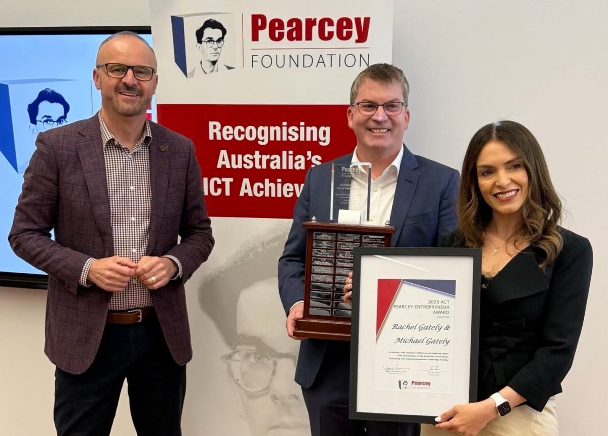 ACT Chief Minister Andrew Barr presenting the Pearcey Foundation ACT Chief Minister's Entrepreneur Award to Trellis Data founders Rachel and Michael Gately