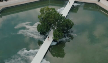 bureau betak places a geometric white runway in a mist-filled landscape for dior