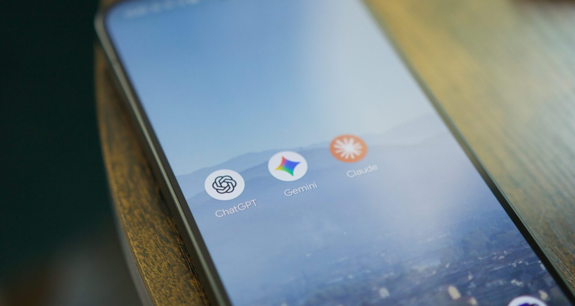 ChatGPT, Gemini, and Claude app icons on a Pixel phone.