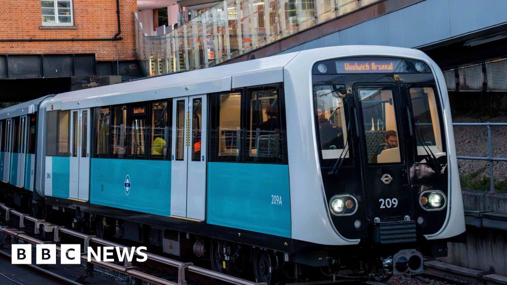 New DLR trains arrive after severe delays and technical checks - BBC