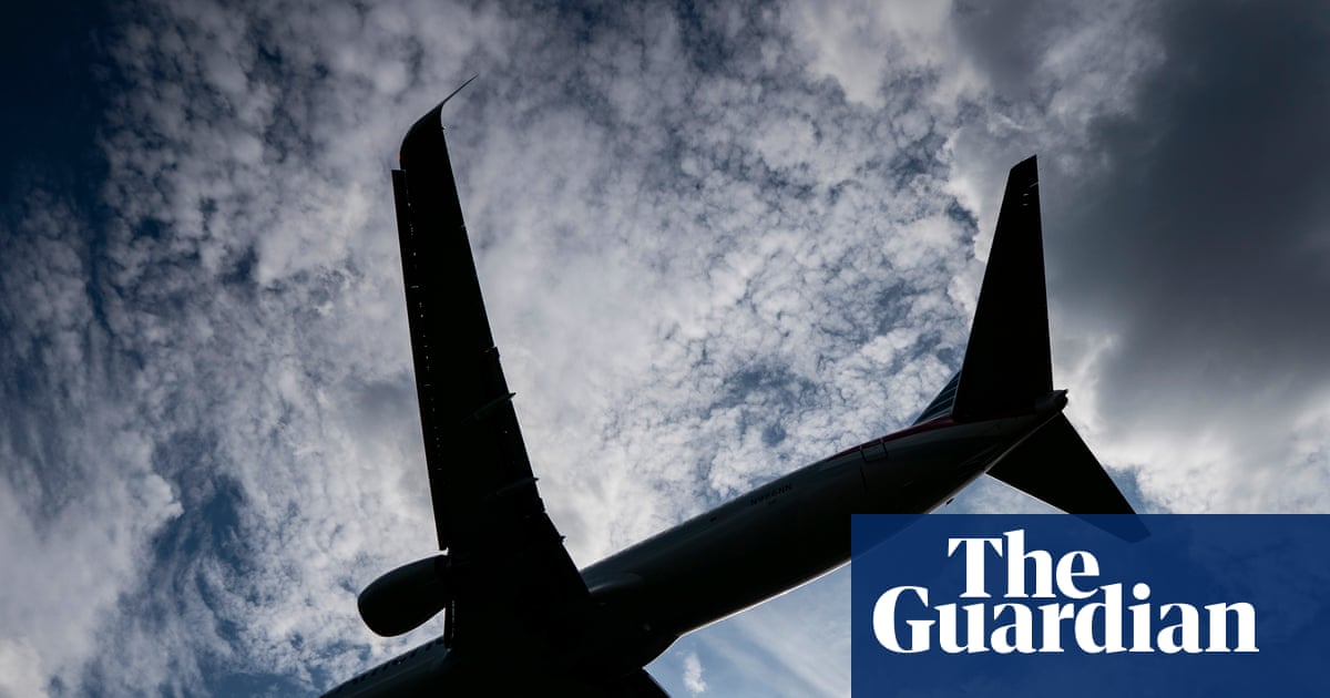 US real estate agent duct-taped and zip-tied to plane seat after ‘racial slurs’ is fired | US crime