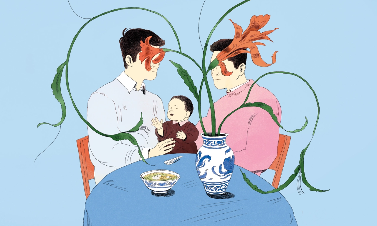 Two parents with orange-flower heads sit at a blue table with a small child between them, surrounded by curling green vines and a blue-and-white ceramic vase