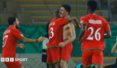 Musab Al-Shaqsy celebrates scoring Oman's third goal in a win against Kuwait