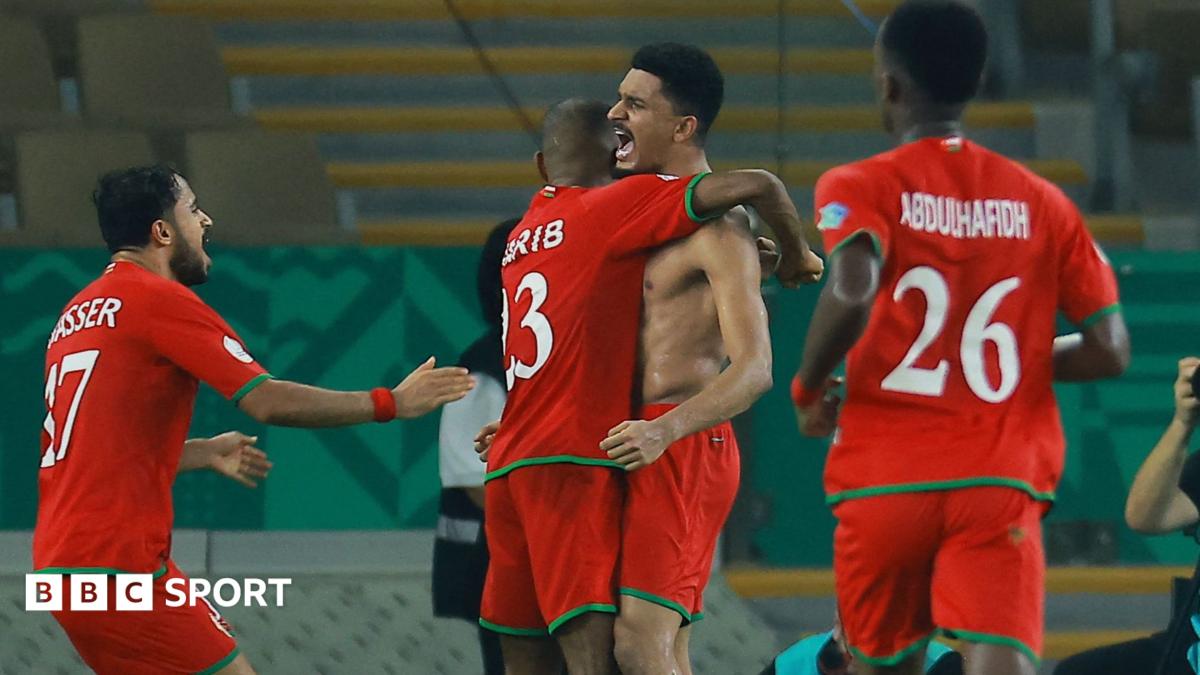 Musab Al-Shaqsy celebrates scoring Oman's third goal in a win against Kuwait