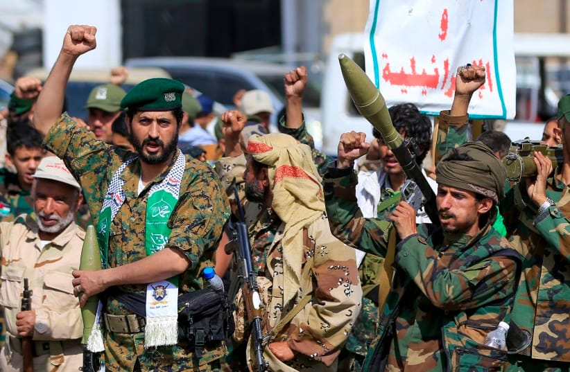 Fighters loyal to the Houthi authorities, shouts slogans during a rally to recruit more fighters, in Sanaa on September 10, 2026.