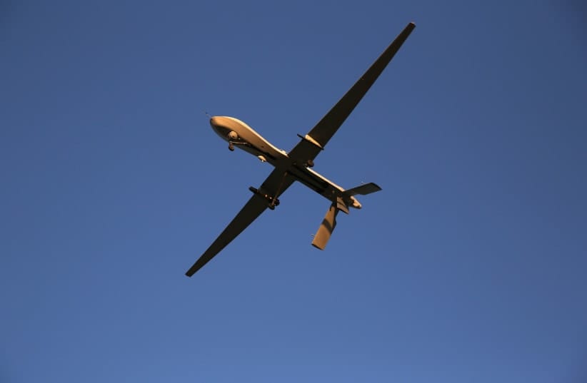 A US Air Force MQ-1B Predator unmanned aerial vehicle (UAV), carrying a Hellfire missile flies over an air base after flying a mission in the Persian Gulf region on January 7, 2016; Illustrative.