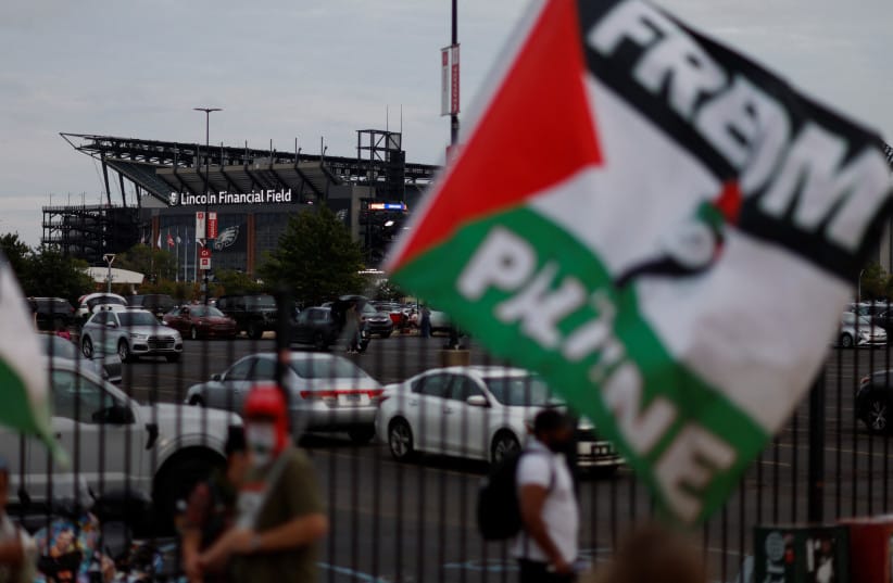 Pro-Palestinian protesters demonstrate near the venue of pop star Ed Sheeran's concert after rapper Macklemore was cut from the musical lineup over his ''free Palestine'' remarks on stage criticizing Israeli government actions in Gaza and the West Bank, near Lincoln Financial Field in Philadelphia, Pe