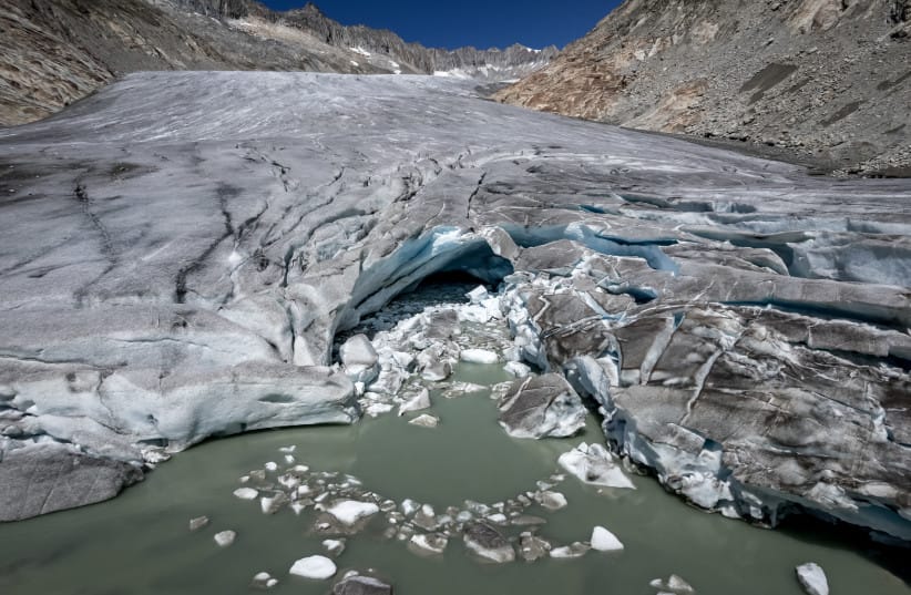 This aerial photograph shows the melting Rhone Glacier, above Gletsch, in the Swiss Alps, on July 24, 2026.