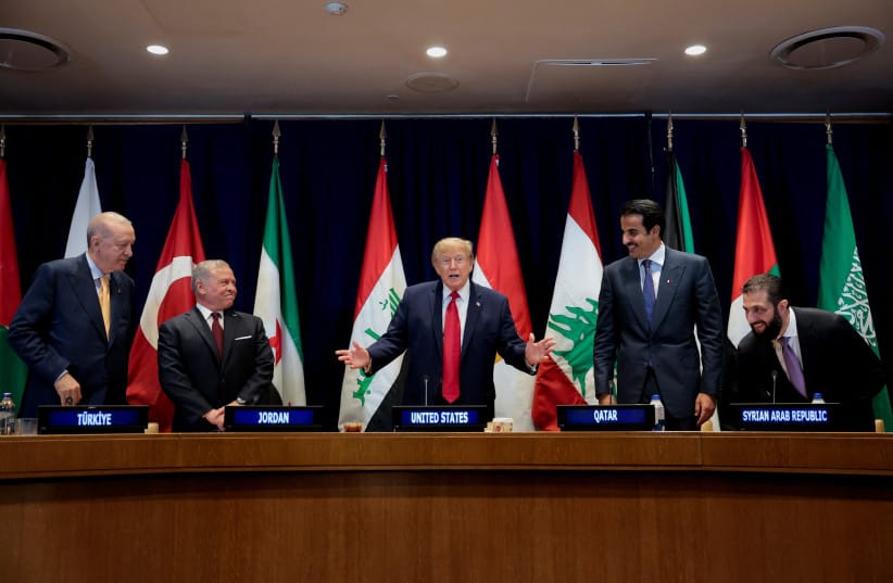 US President Donald Trump, flanked by Turkish President Recep Erdogan, Jordan's King Abdullah II, Qatar's Emir Sheikh Tamim bin Hamad Al Thani and Syria's President Ahmed al-Sharaa, gestures during a multilateral meeting with leaders from the Gulf Cooperation Council, which includes the United Arab
