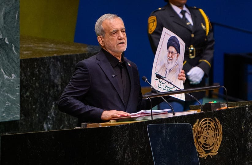 President of Iran Masoud Pezeshkian holds up a poster of assassinated Supreme Leader of Iran Ali Khamenei while addressing the 81st session of the United Nations (UN) General Assembly at UN Headquarters on September 23, 2026 in New York City.