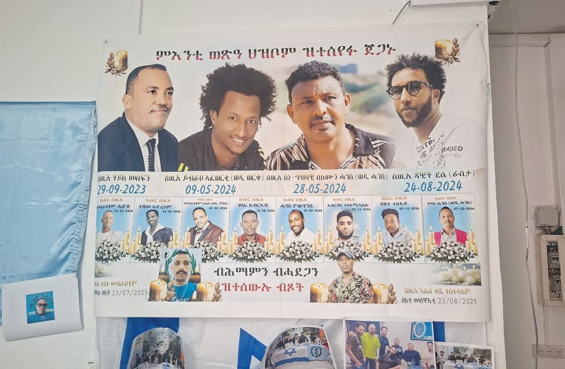 A MEMORIAL display at the Eritrean opposition movement’s office in Tel Aviv commemorates members of the community who died in Israel. Activists say some of their dead remain buried in Israel because returning their bodies to Eritrea would be impossible while the current government remains in power.