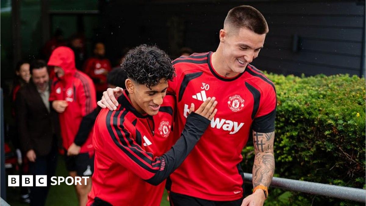 JJ Gabriel (left) has a joke with Manchester United team-mate Benjamin Sesko