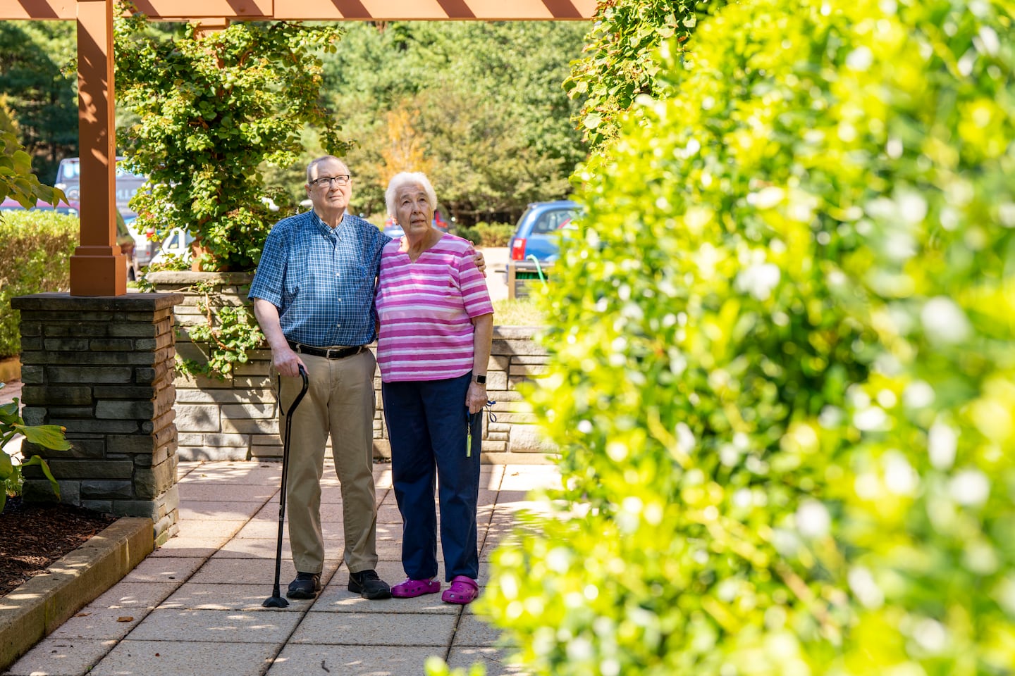 Carol and Eldon Clingan outside their apartment on the NewBridge on the Charles campus in Dedham last month after receiving a letter from Mass General Brigham Health Plan's Medicare Advantage.