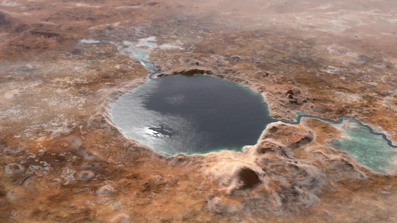 Round lake seen from above, with rivers running into it.
