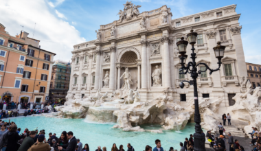 Rome pulls around €1.5 million in coins from the Trevi Fountain every year and gives it to a Catholic charity — workers sweep the coins into long piles and vacuum them through suction hoses as new wishes keep landing in the water