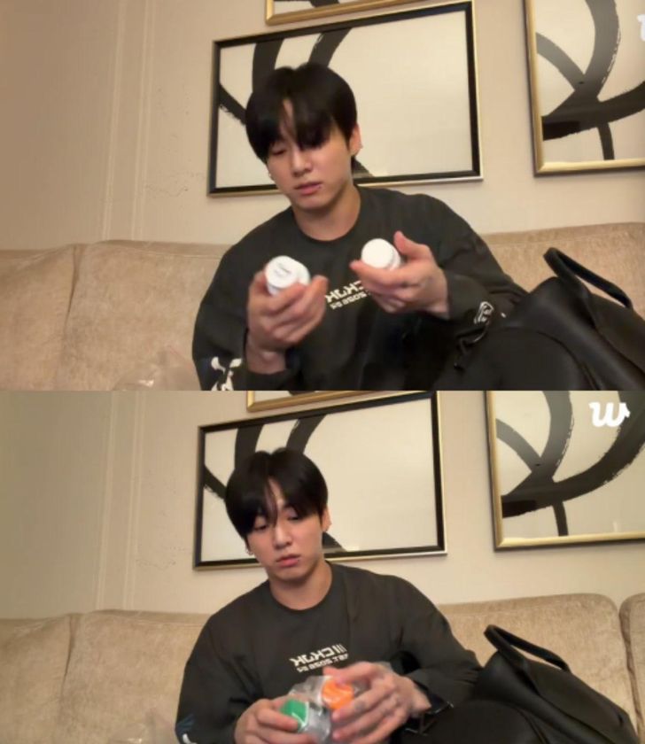 BTS member Jung Kook shows medications and supplements during a Weverse livestream. Captured from Jung Kook’s Weverse livestream