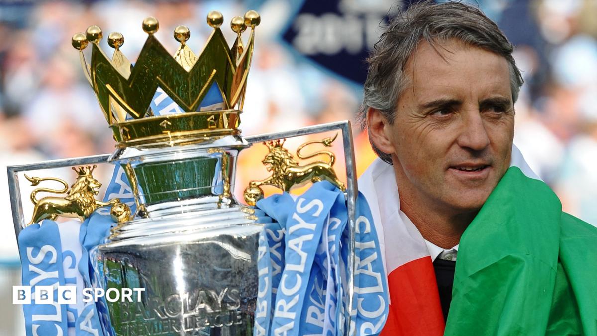 Manchester City manager Roberto Mancini with the Premier League trophy