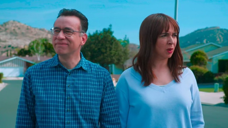 Oscar and June holding hands and walking down the street on Forever S1E3