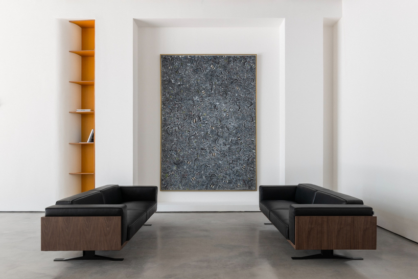 dubai gallery pairs open white exhibition halls with a concealed, brick-toned museum room - 2