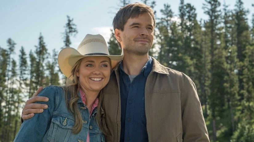 A man and a woman wearing western clothing and embracing in Heartland