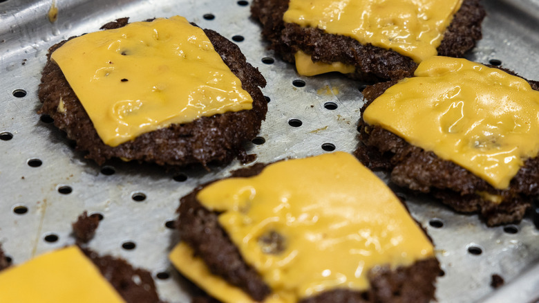 A collection of cheeseburger patties