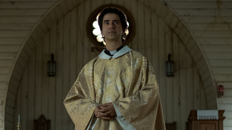 Hamish Linklater as Father Paul in a chapel in Midnight Mass