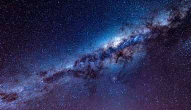 Every galaxy in our neighborhood, including our own, is being pulled toward a single point in space hidden directly behind the crowded disk of the Milky Way, and when astronomers finally looked through the dust, they found a large, previously hidden cluster of thousands of galaxies sitting almost exactly where the pull was coming from