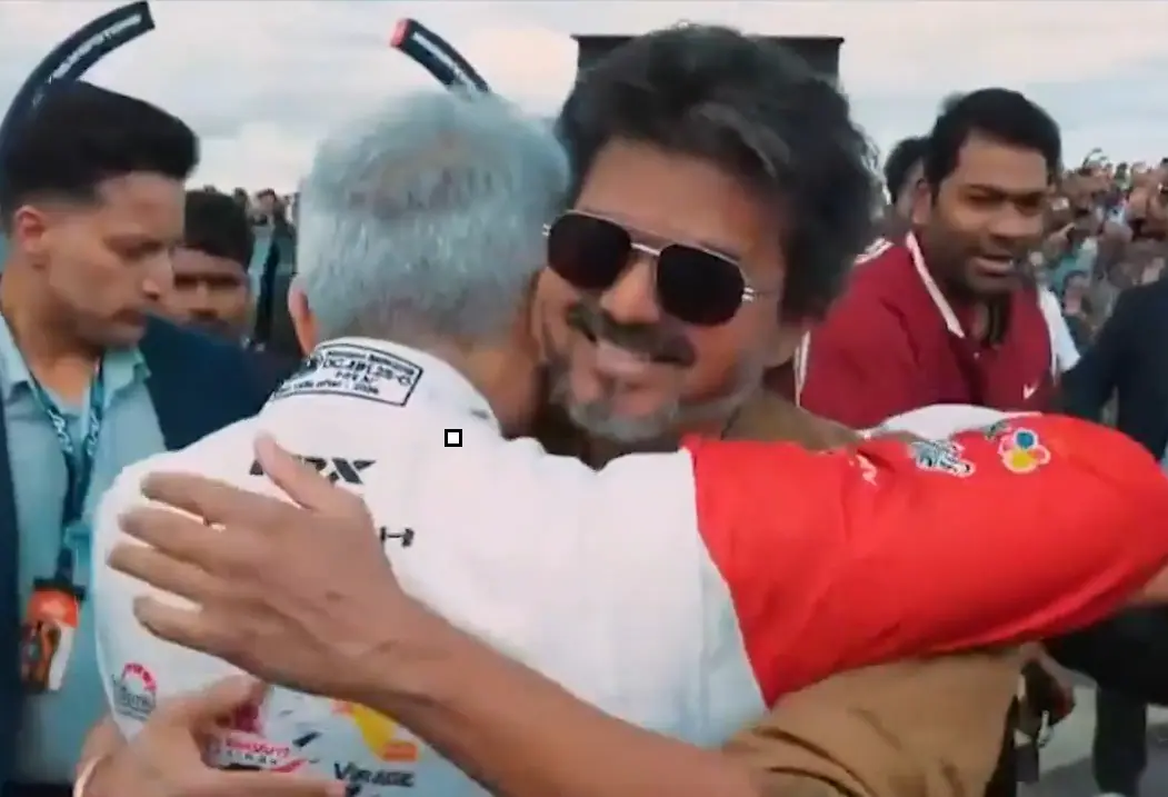 Vijay hugs Ajith ahead of the latters race at Silverstone Vijay hugs Ajith ahead of the latters race at Silverstone
