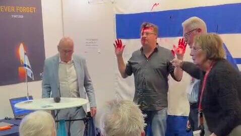 Man arrested after spraying red paint on Israeli flag at Sweden book fair