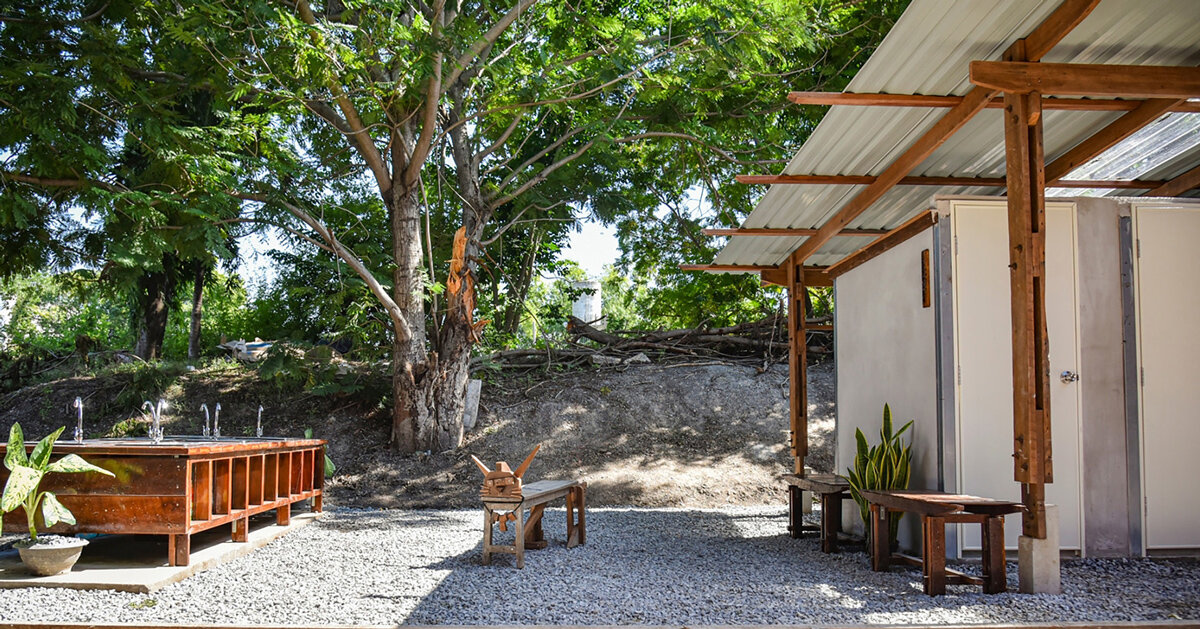 volunteers in thailand build school toilet from reclaimed wood