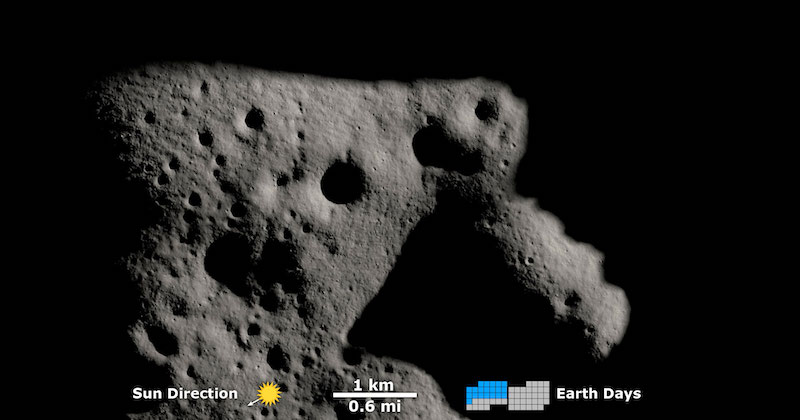 Shadowy gray landscape with craters.