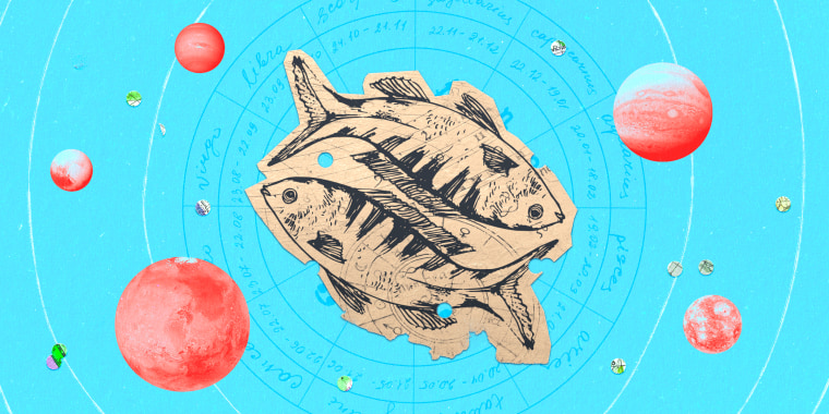 Paper cutout of the pisces zodiac on a blue background