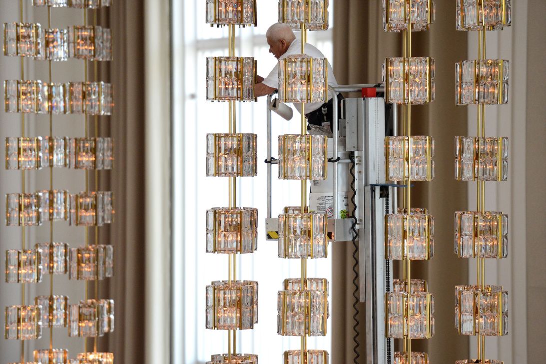 A worker removes crystal from a chandelier, to be cleaned, in the Grand Foyer of the John F. Kennedy Center for the Performing Arts in January 2013. The chandelier is one of sixteen that hang in the building, a gift from Sweden.