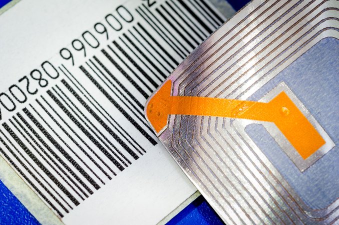 a close-up photo showing a transmitter tag, a sticker with metal etched on it