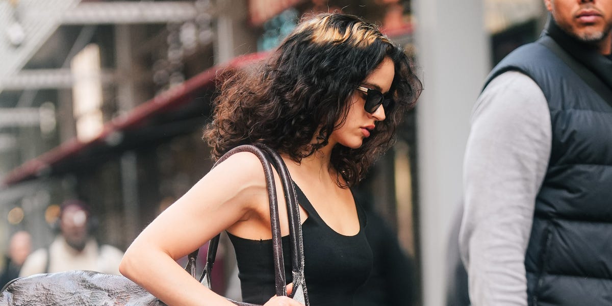 Rosalía Wears a Massive Printed-Leather Duffel Bag With Sky-High Ballerina Heels