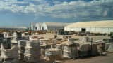 Spools of electrical wires outside a series of assembly tents during a media tour of the Stargate AI data center in Abilene, Texas, US, on Tuesday, Sept. 23, 2025. Stargate is a collaboration of OpenAI, Oracle and SoftBank, with promotional support from President Donald Trump, to build data centers and other infrastructure for artificial intelligence throughout the US.