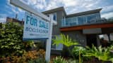 A "For Sale" sign outside a single-family home in Carlsbad, California, U.S., Sept. 16, 2026. 