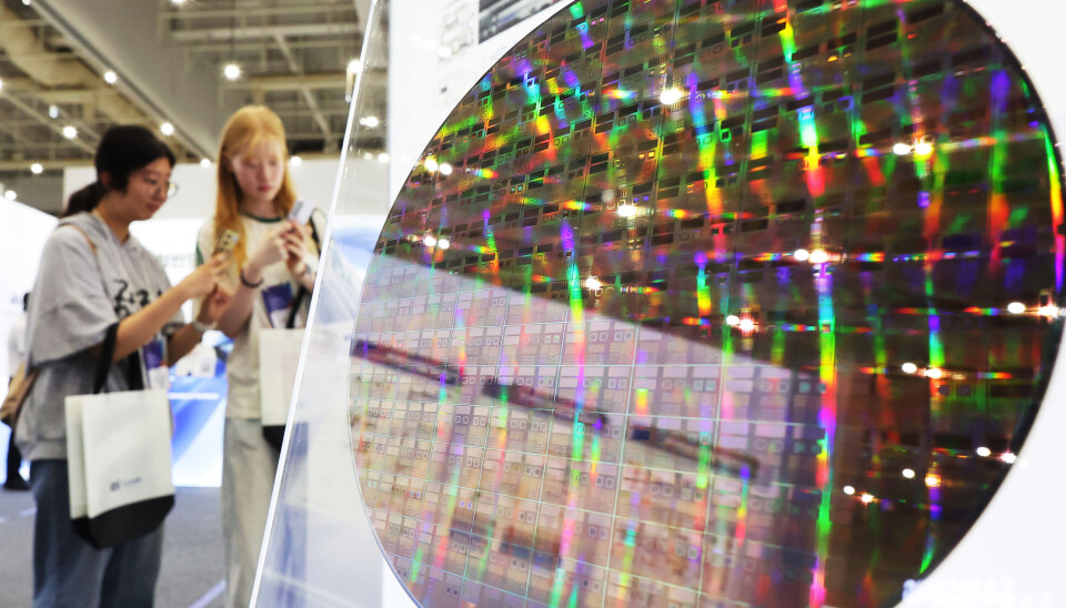 Visitors observe semiconductor-related products and technologies at an exhibition held in Suwon, Gyeonggi, on Aug. 26.