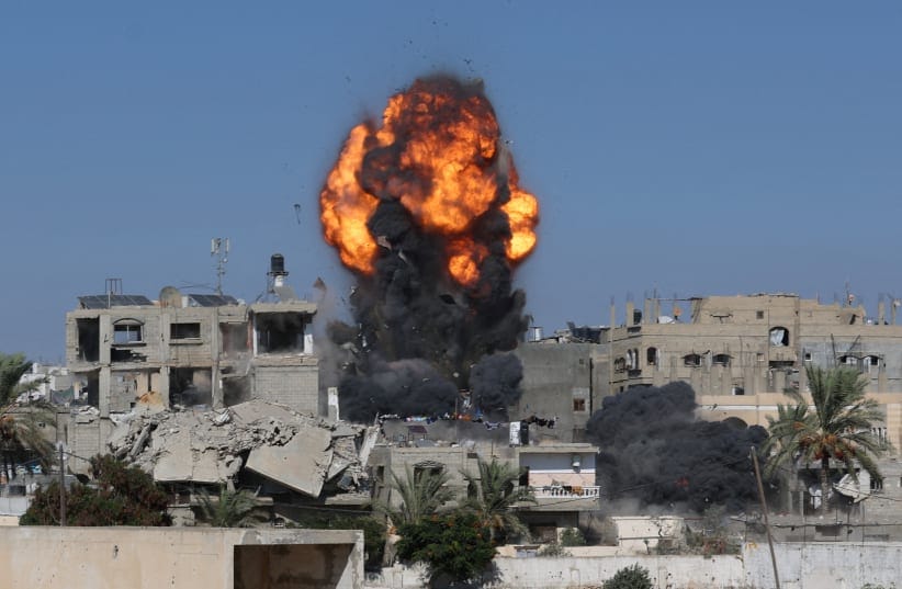 Smoke and flames rise from a house during an Israeli strike, carried out after the IDF warned residents to evacuate the area, in Khan Younis, in the southern Gaza Strip, September 9, 2026. 