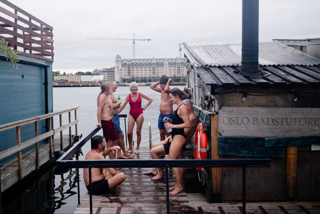 Sauna enthusiasts enjoy an early morning sauna session during the International Sauna Congress 2026 in Oslo, Norway, Sept. 25, 2026. In Oslo Harbor, next to the Opera House and the Munch Museum, lies Sukkerbiten — the Oslo Sauna Association’s cluster of many small saunas in a variety of styles, lined up along the pier.