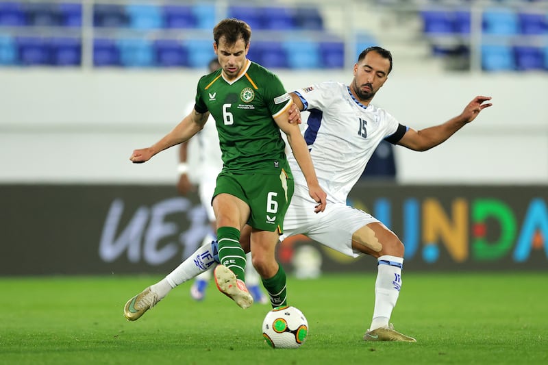 Jayson Molumby passes the ball under pressure from Eliel Peretz of Israel. Photograph: Srdjan Stevanovic/Getty Images