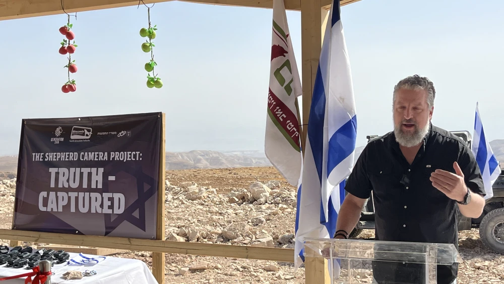 Generation Zion founder Luke Moon speaks at the launch of the Shepherd Camera Project at the Ruach Ha’aretz agricultural farm in Binyamin, Oct. 8, 2026. Photo by Josh Hasten.