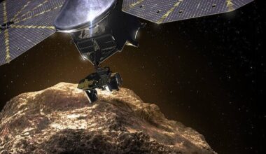 Lucy mission: Metal spacecraft with 2 round solar panels hovering close over a rocky body in space.