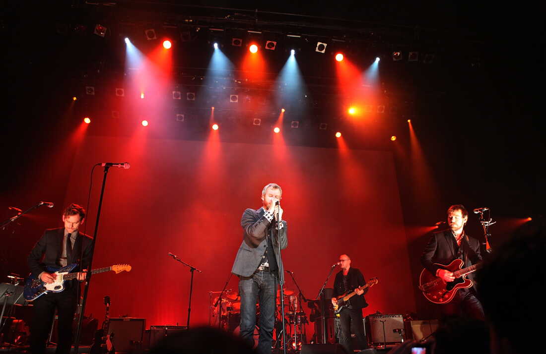 Bryce Dessner, (left) Matt Berninger and Aaron Dessner of The National perform onstage at the Brooklyn Academy of Music in 2010. 