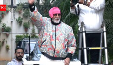 Amid bomb threat email and health concerns, Amitabh Bachchan greets fans outside Jalsa, protective son Abhishek Bachchan joins his father |