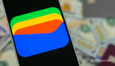 Google Wallet logo on smartphone next to credit cards and cash Stock photo 12 1000w 563h