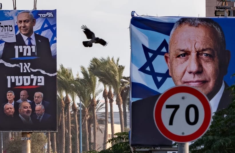 Election campaign billboards featuring Yashar party chairman Gadi Eisenkot and Likud party chairman and Israeli Prime Minister Benjamin Netanyahu alongside opposition leaders are displayed along a roadside in the northern Israeli city of Haifa, ahead of Israel’s upcoming general elections.
