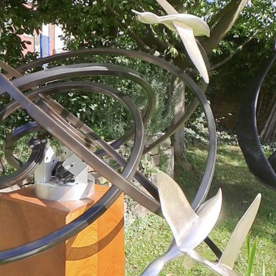 A Mesmerizing Kinetic Sculpture of Ducks in Flight